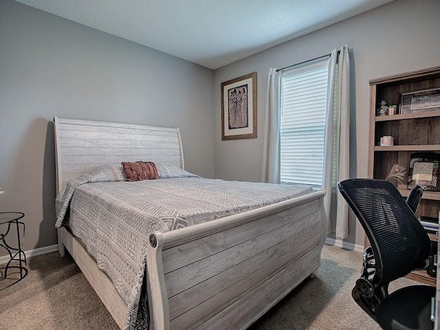 bedroom with dark colored carpet