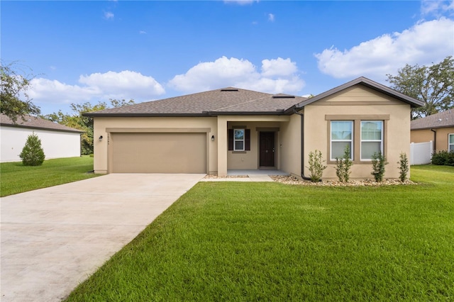 view of front of property with a front lawn and a garage