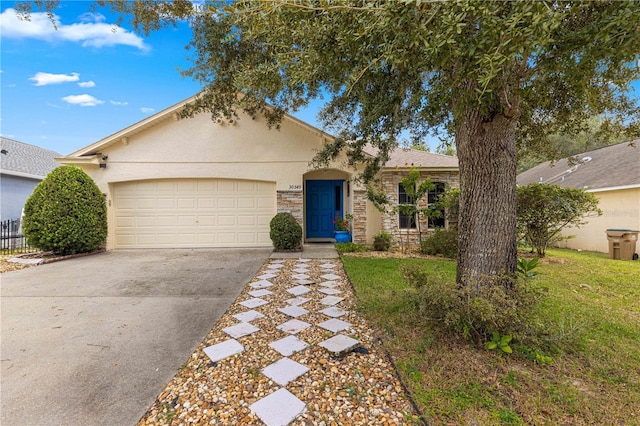 single story home with a front lawn and a garage