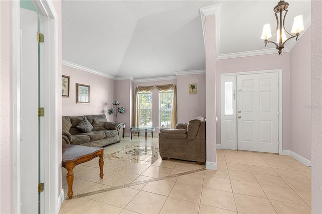 tiled foyer with ornamental molding, vaulted ceiling, and a notable chandelier