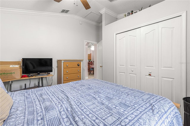 bedroom featuring ceiling fan, a closet, crown molding, and vaulted ceiling