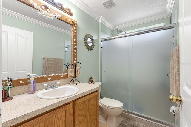 bathroom featuring vanity, crown molding, toilet, and a textured ceiling