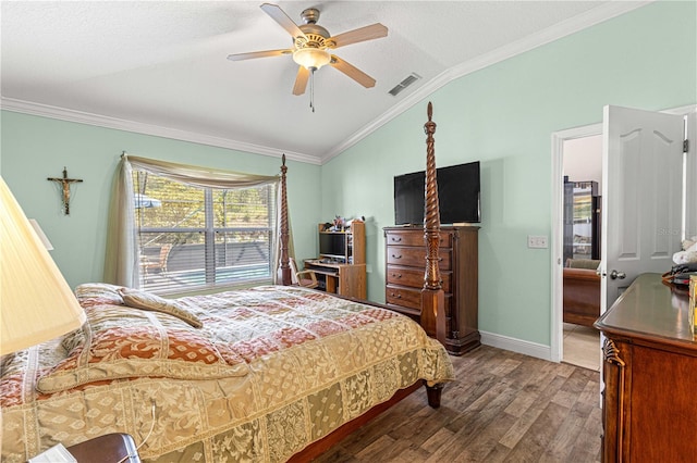 bedroom with ornamental molding, vaulted ceiling, dark hardwood / wood-style floors, and ceiling fan