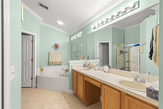 bathroom with a textured ceiling, separate shower and tub, tile patterned floors, crown molding, and vanity