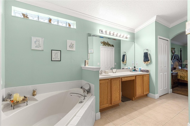 bathroom featuring vanity, a textured ceiling, tile patterned floors, tiled bath, and crown molding