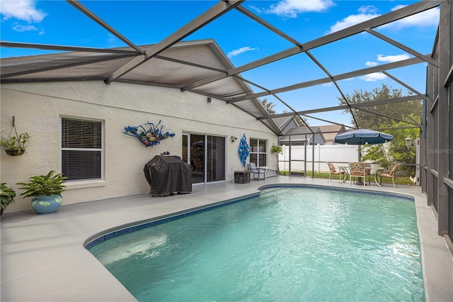 view of pool featuring a lanai and a patio area