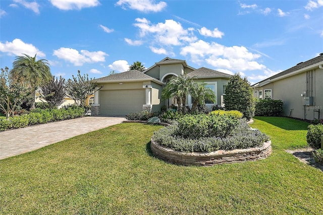 view of front of house with a front lawn and a garage