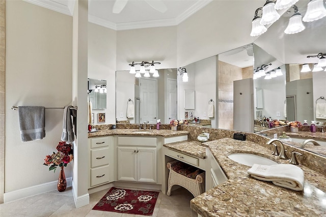 bathroom featuring tile patterned flooring, vanity, and ornamental molding