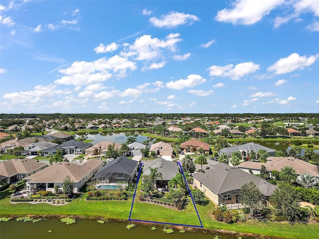 bird's eye view with a water view