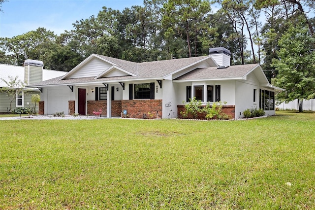 single story home with a front lawn