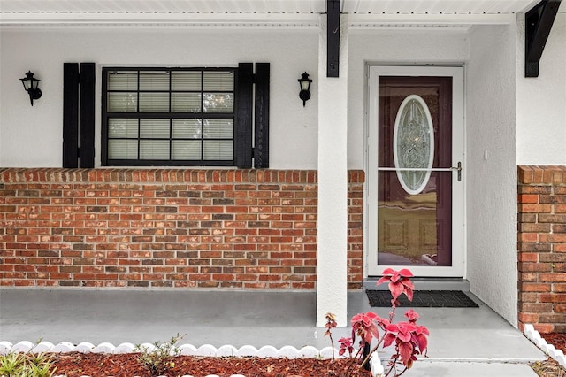 doorway to property featuring a porch