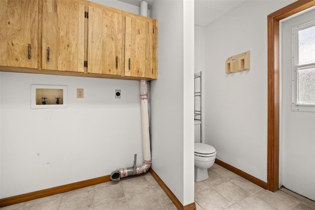 washroom with light tile patterned floors, hookup for an electric dryer, washer hookup, and cabinets