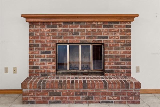 details featuring a fireplace and tile patterned floors