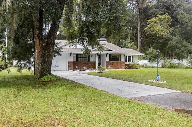 ranch-style house with a front yard and a garage