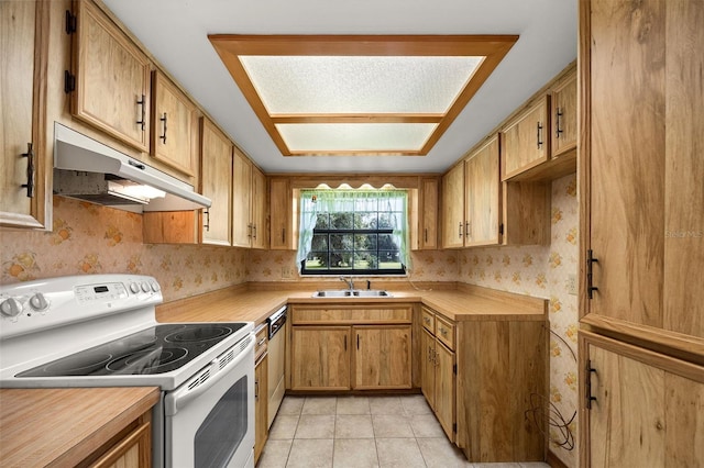 kitchen featuring dishwashing machine, light tile patterned flooring, white electric range, and sink