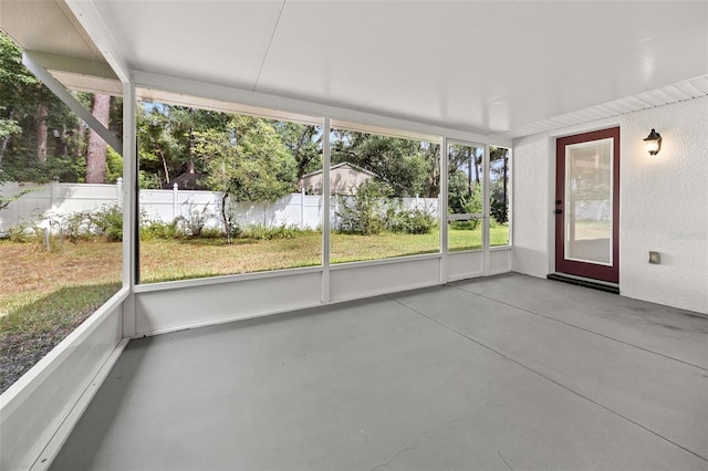 unfurnished sunroom featuring a wealth of natural light