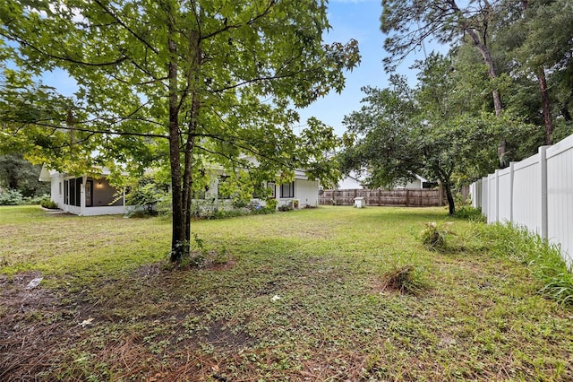 view of yard with a sunroom