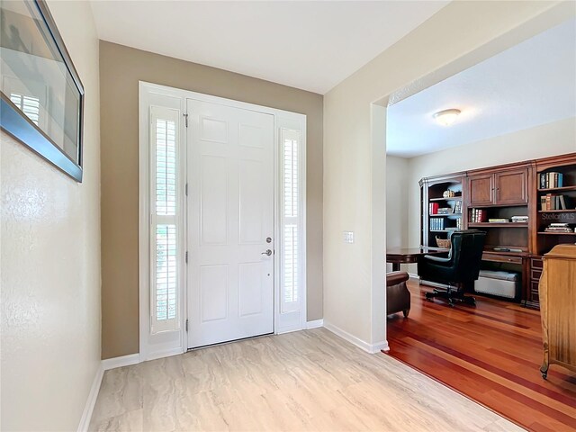 entryway with light hardwood / wood-style flooring