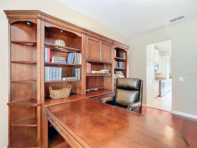 office with light hardwood / wood-style floors