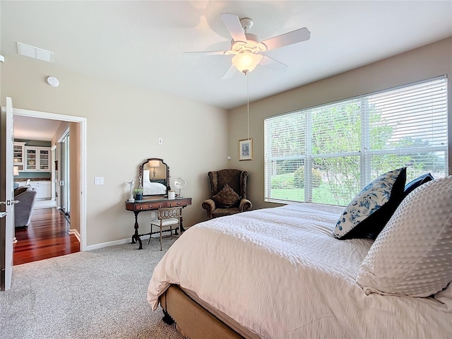 bedroom with ceiling fan and carpet flooring