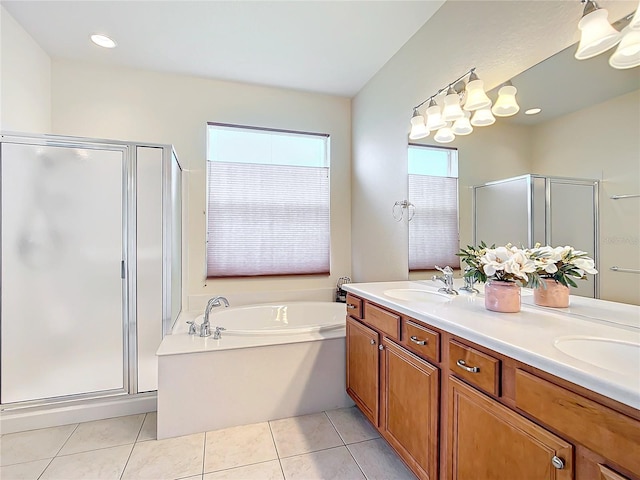 bathroom featuring vanity, separate shower and tub, and tile patterned floors