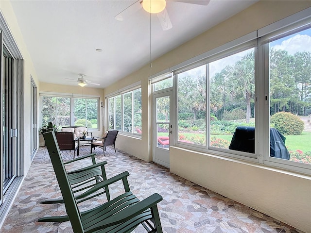 sunroom featuring a wealth of natural light and ceiling fan