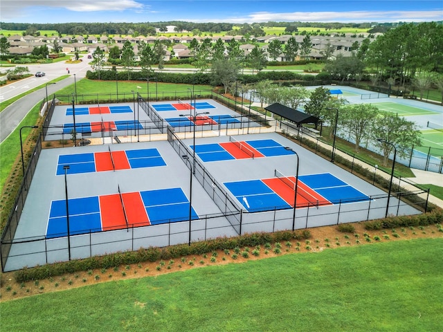 view of basketball court featuring tennis court