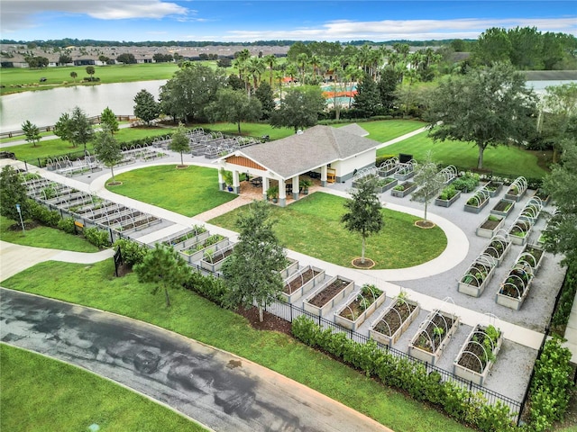 birds eye view of property with a water view