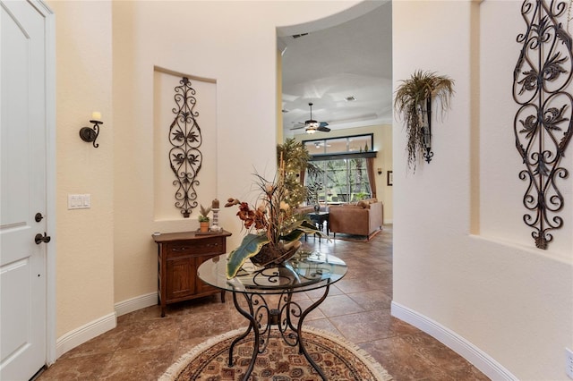 hall featuring ornamental molding