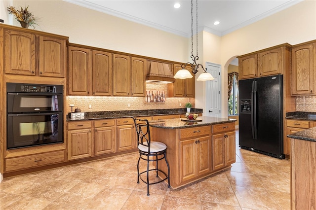 kitchen with backsplash, pendant lighting, black appliances, crown molding, and a center island