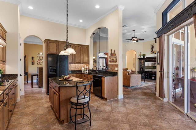 kitchen with tasteful backsplash, black appliances, ceiling fan, ornamental molding, and sink