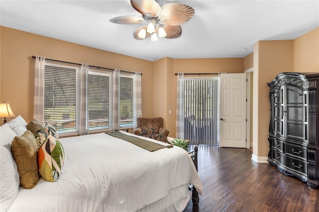 bedroom with dark hardwood / wood-style floors and ceiling fan