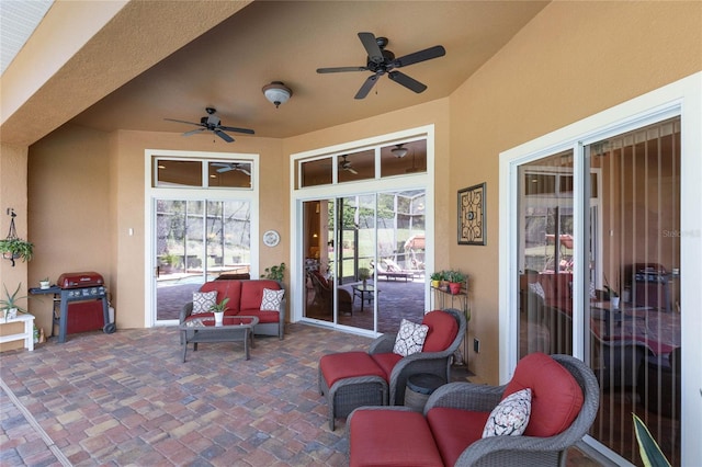 view of patio with ceiling fan and outdoor lounge area