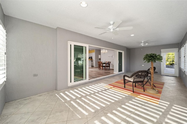 sunroom / solarium with ceiling fan