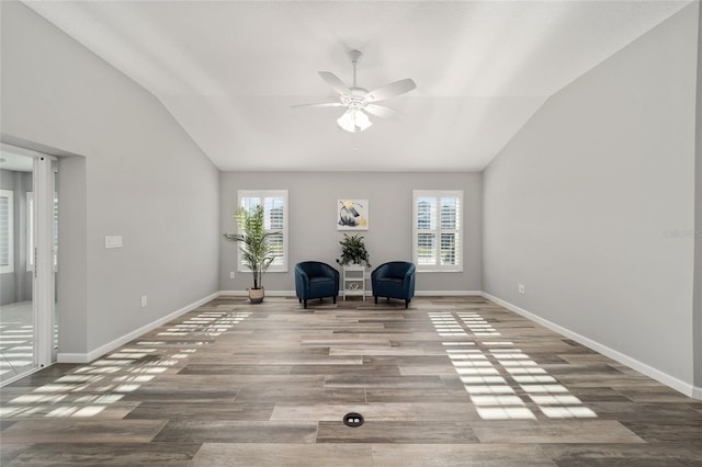 unfurnished room featuring vaulted ceiling, wood-type flooring, and ceiling fan