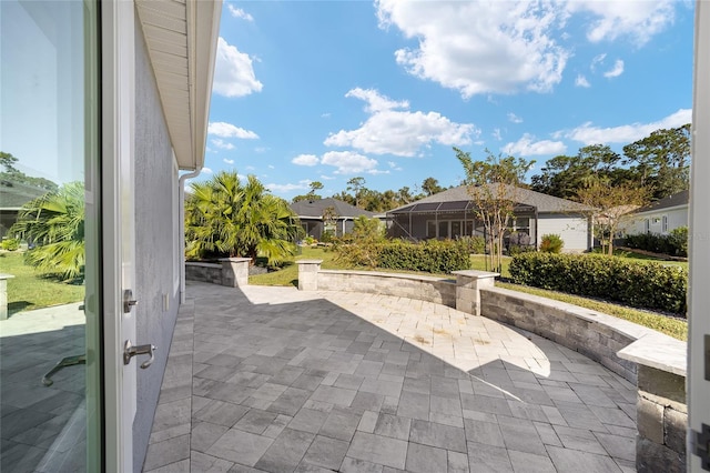 view of patio with a lanai