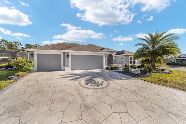 view of front facade featuring concrete driveway, an attached garage, and stucco siding