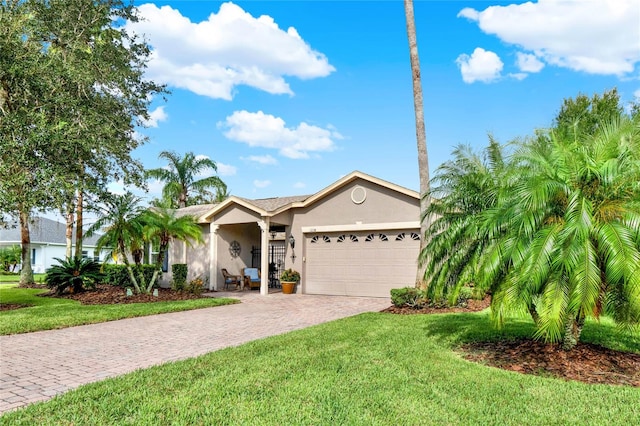 ranch-style house with a garage and a front yard