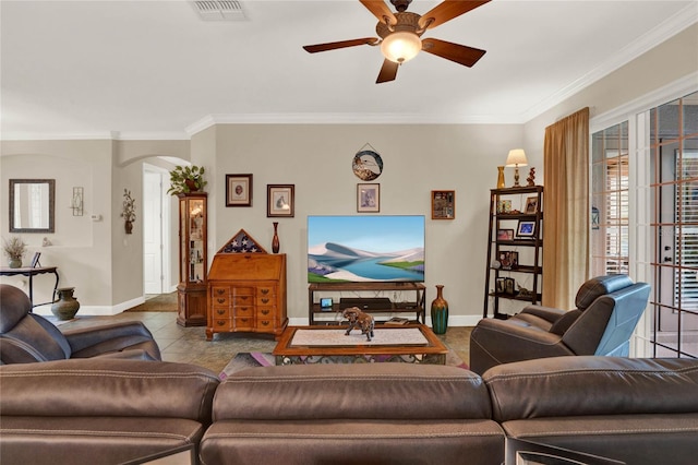 tiled living room featuring ceiling fan and crown molding