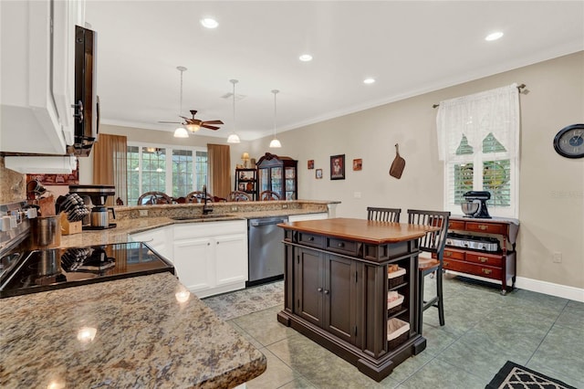 kitchen featuring kitchen peninsula, a kitchen island, stainless steel appliances, and white cabinets