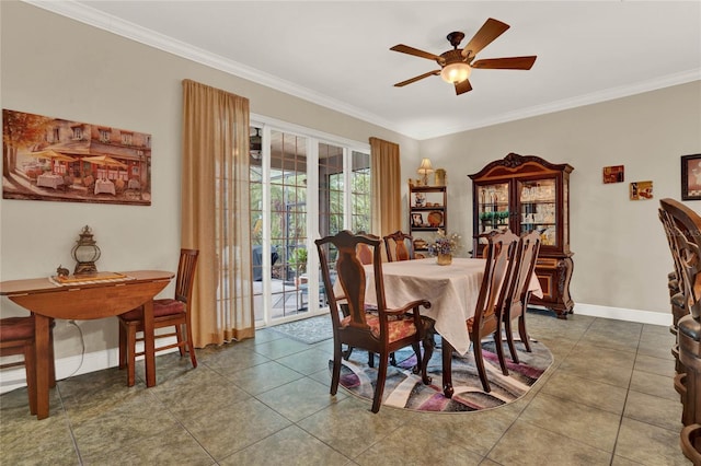 dining space with ornamental molding, tile patterned flooring, and ceiling fan