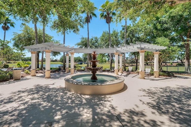 surrounding community with a pergola and a water view