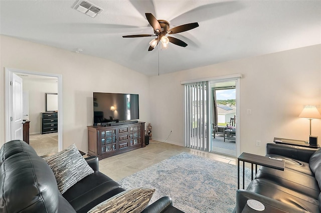 living room with ceiling fan and vaulted ceiling