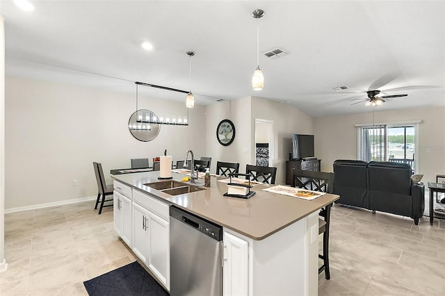 kitchen with white cabinets, sink, stainless steel dishwasher, decorative light fixtures, and a center island with sink