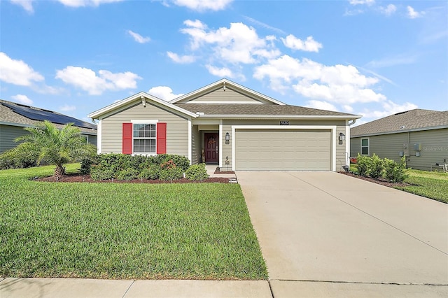 view of front of property featuring a garage and a front lawn