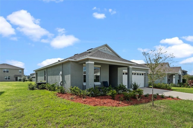 view of front of property featuring a garage and a front lawn