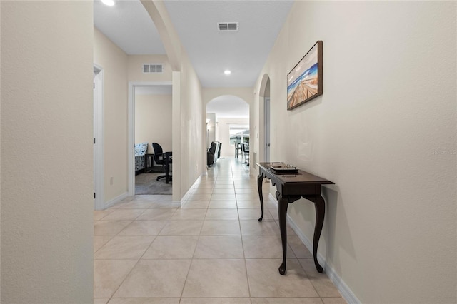 hallway featuring light tile patterned flooring