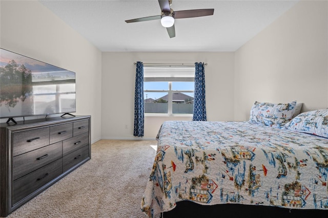 bedroom featuring ceiling fan and light colored carpet