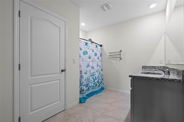 bathroom with vanity, a shower with shower curtain, and tile patterned floors