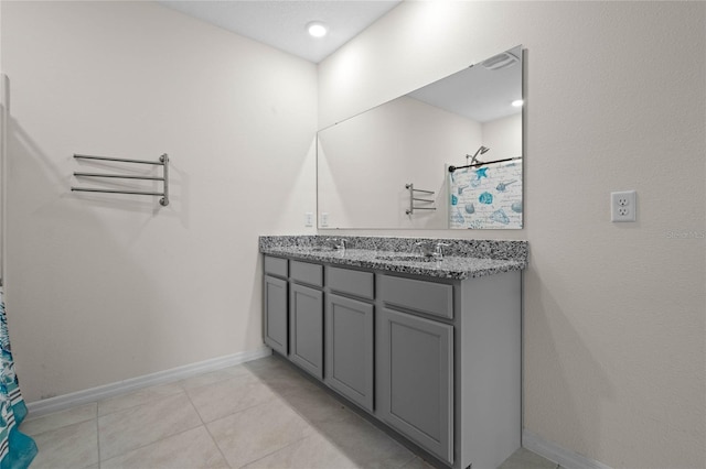 bathroom featuring tile patterned flooring, vanity, and a shower with shower curtain